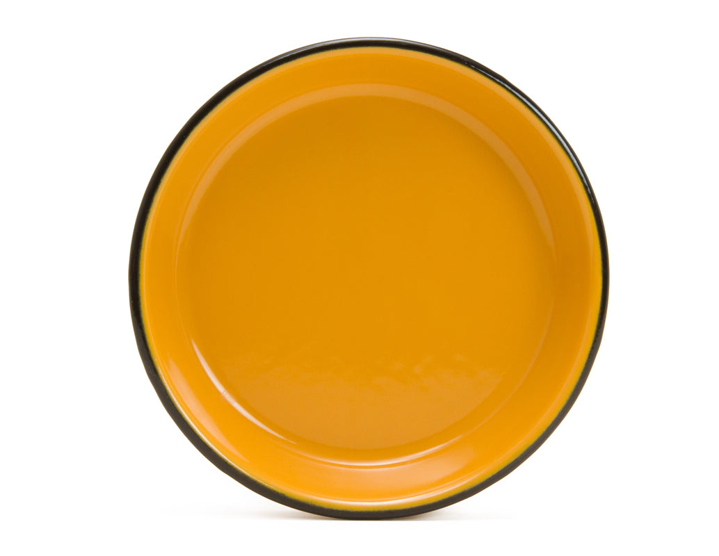 Plato hondo de peltre mostaza con borde negro